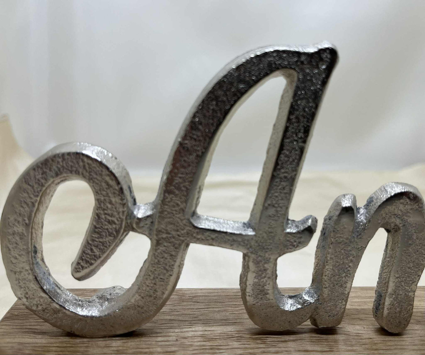 "Amour" en aluminium coulé sur socle de bois Gmbh (28*11cm)