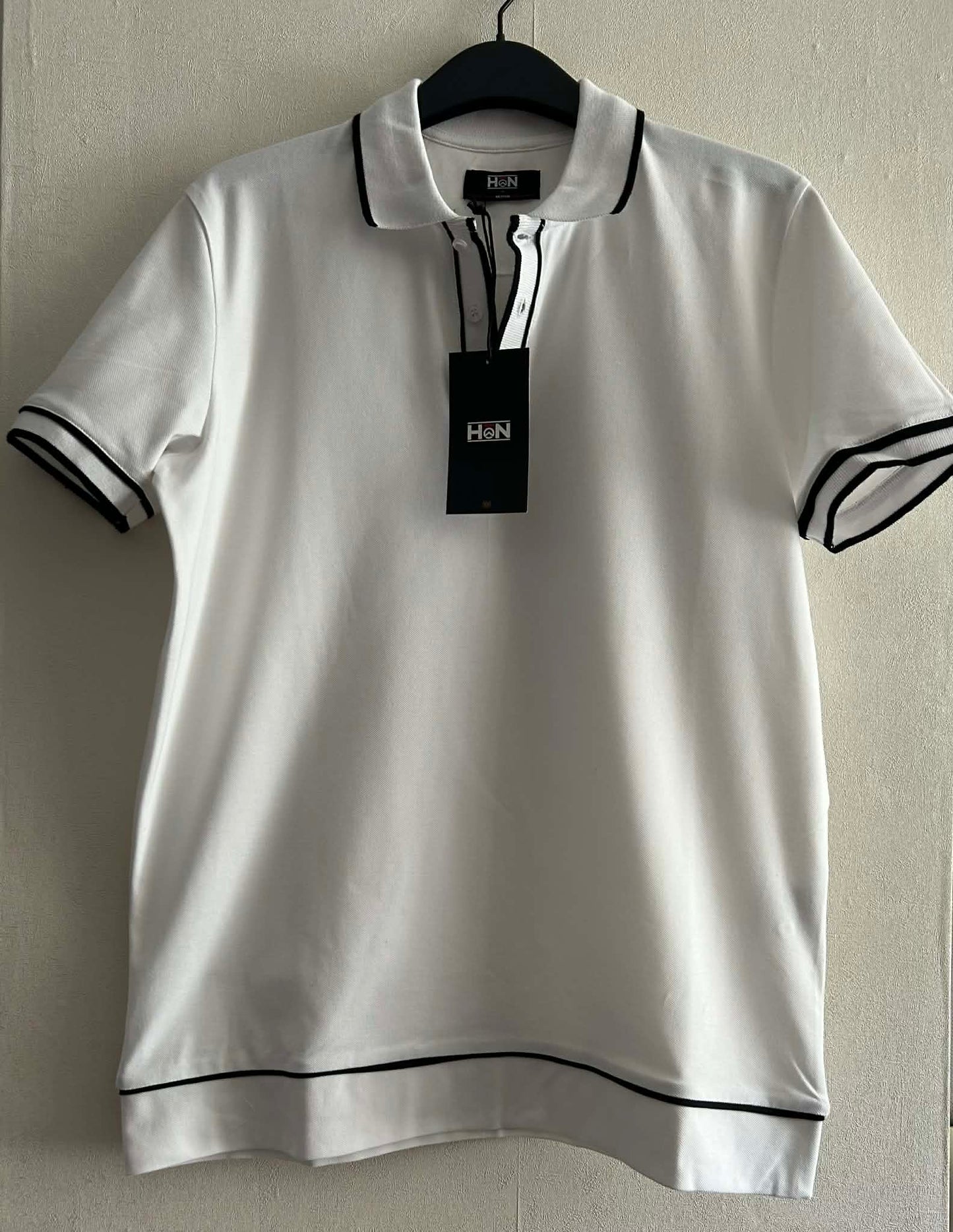 Polo blanc et noir 95 %coton 5% élasthanne HON