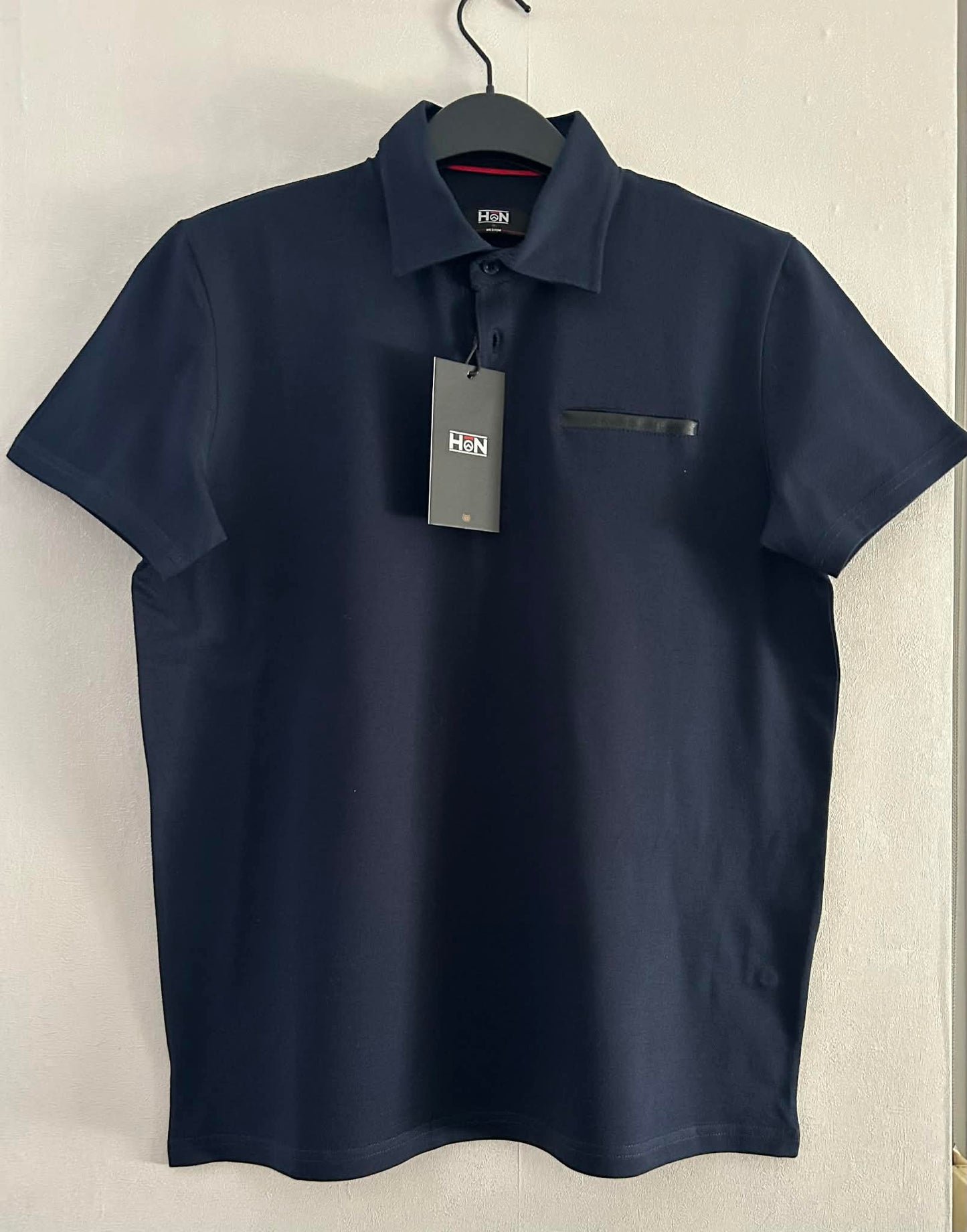 Polo marine  95 % coton 5% élasthanne de Hon